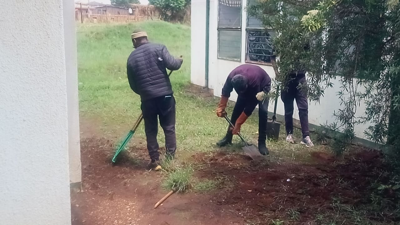Men working outside the centre